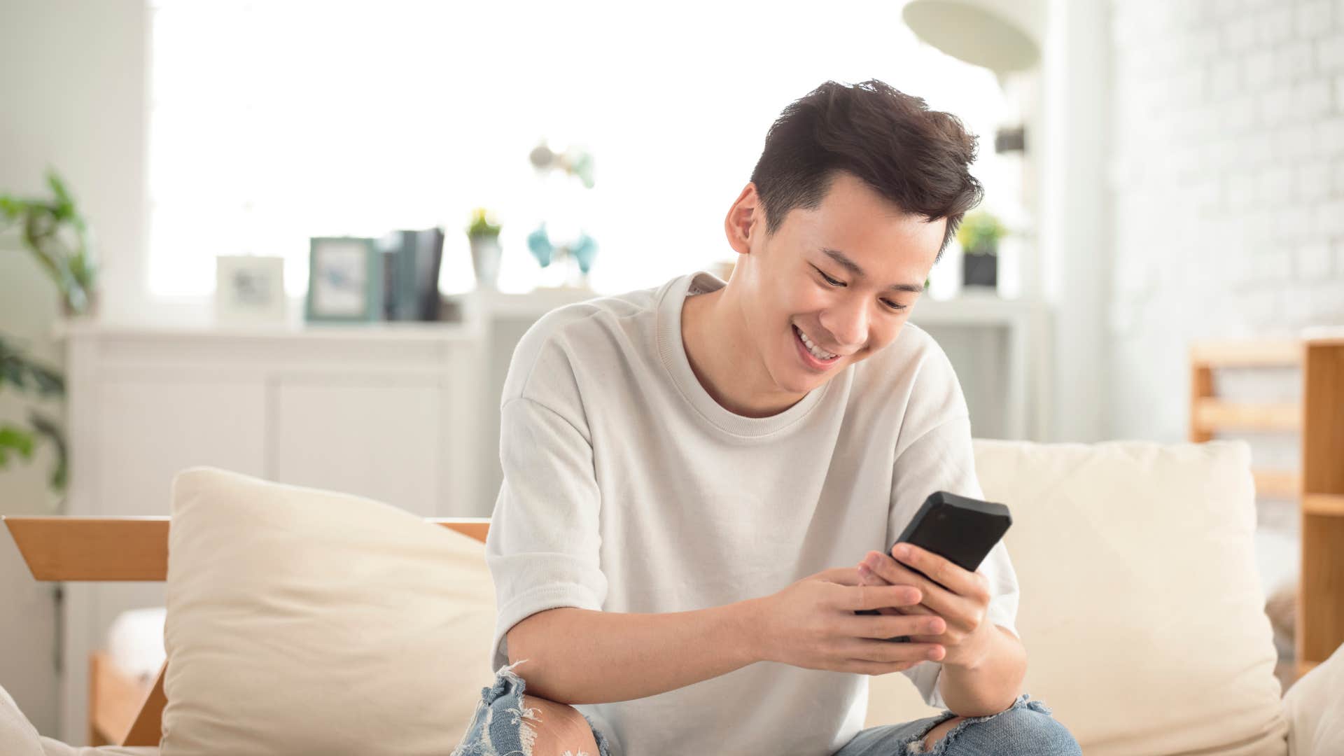 man getting unusual text message of partner being authentic
