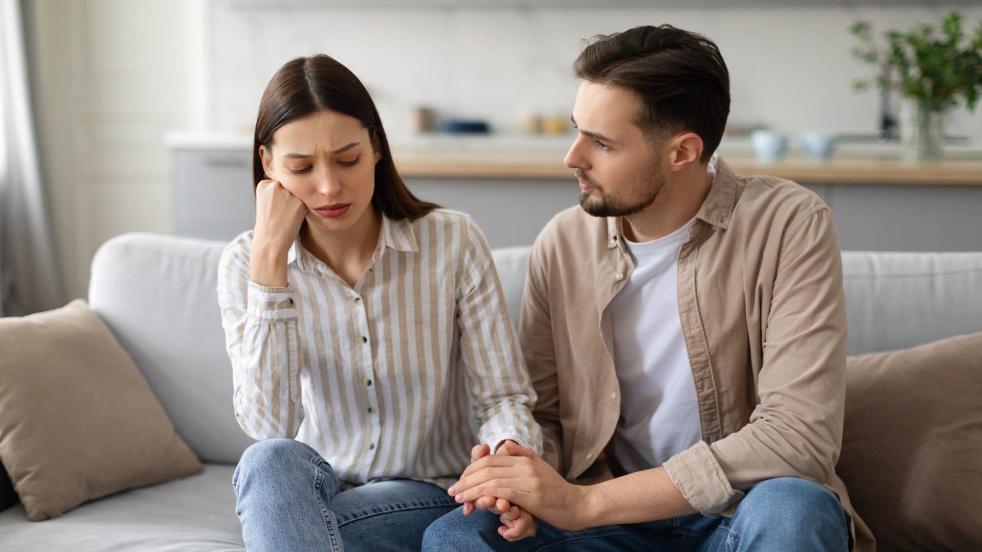 couple stressed about unwanted attention in their new relationship