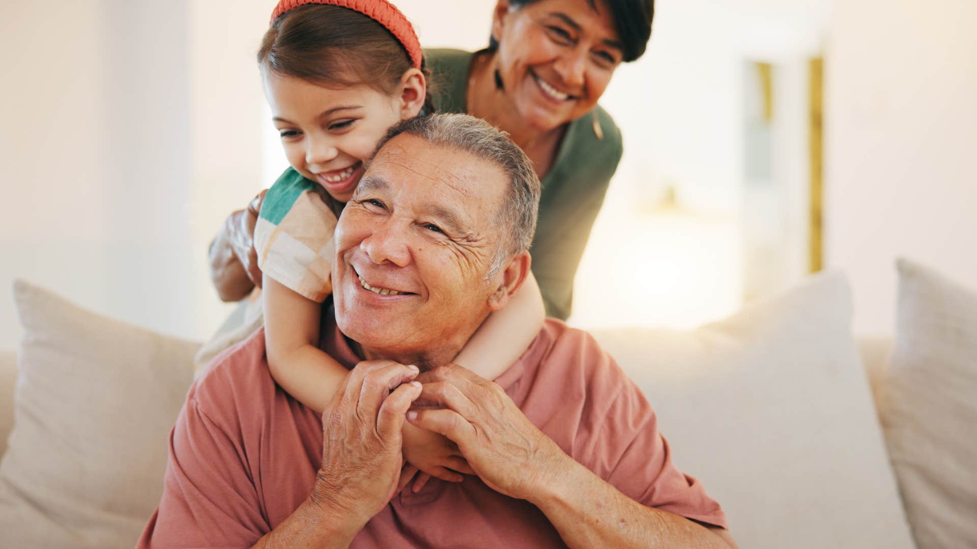 boomer grandparents watching their grandchildren