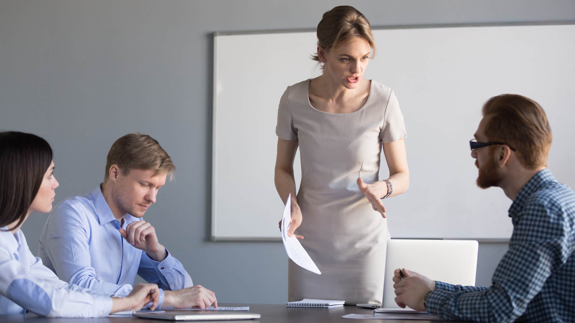 woman drawing a line of boundaries with disrespectful coworkers