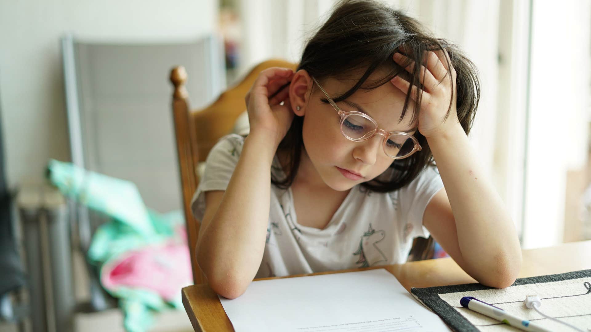 child struggling with schoolwork because their parents protected them from discomfort and failure