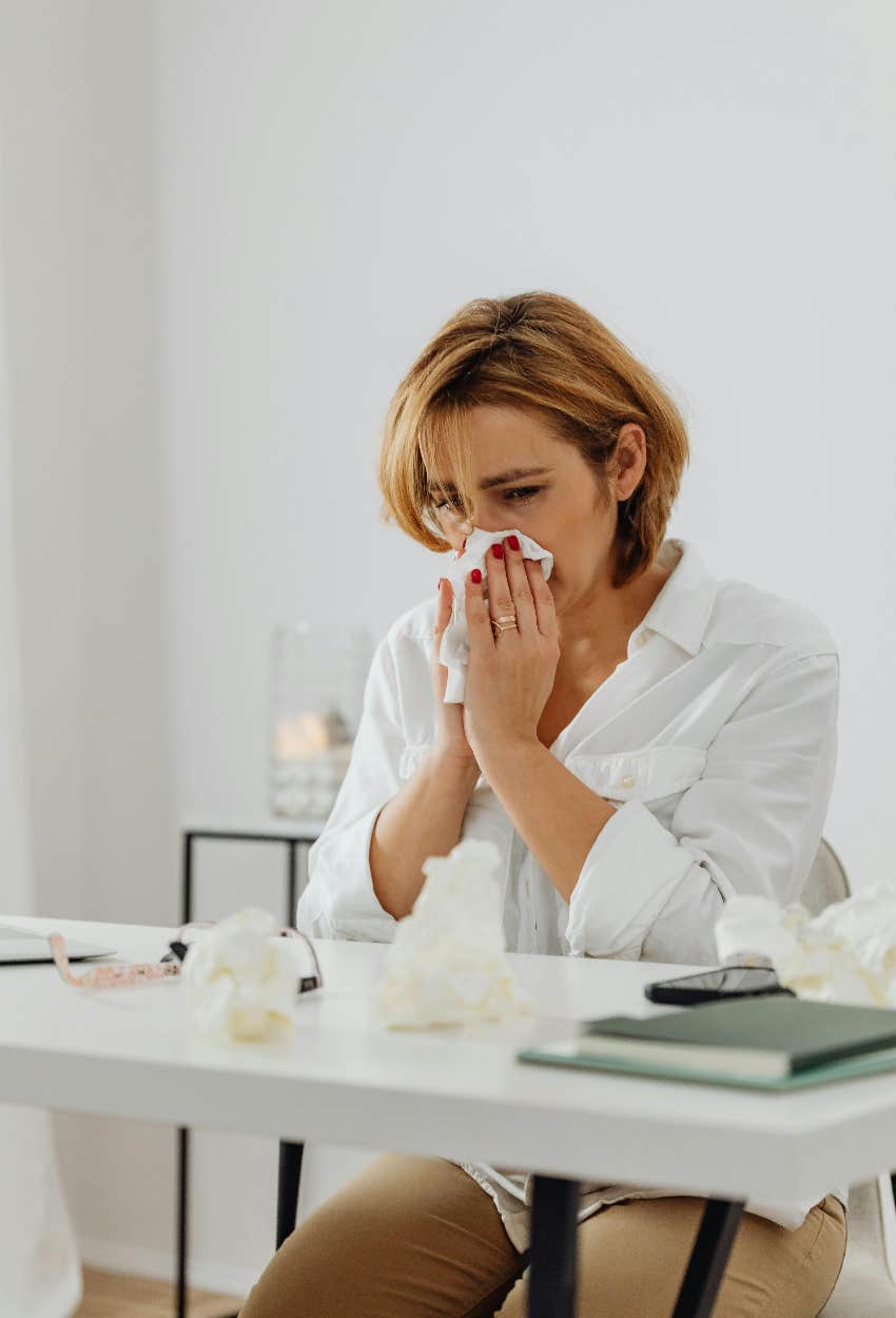 woman crying after deciding to stay with her husband