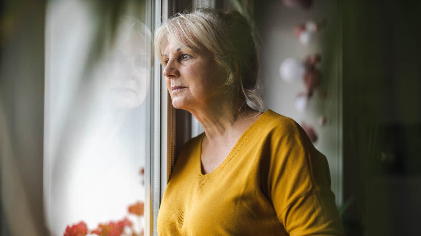 Woman watching neighbor while she cleans because she draws her husband's attention