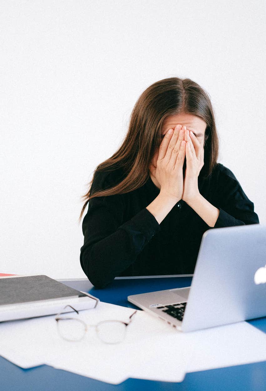 sad woman trying to pay her bills