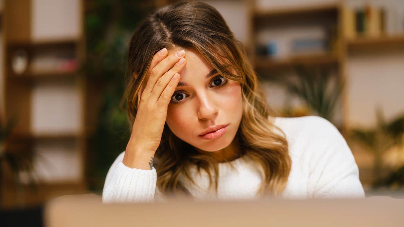 These Work Behaviors Felt Normal — Until They Nearly Burned Me Out Woman feeling burned out from work behaviors that felt normal.