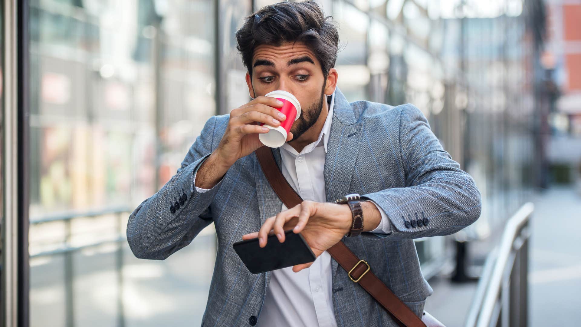 man being late and looking at his watch