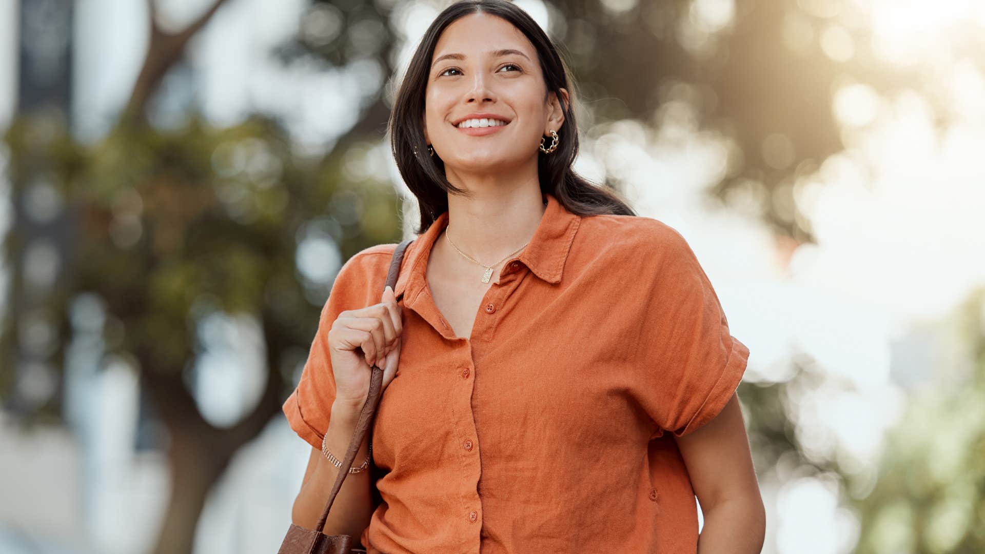 woman smiling after saying excuse me on the street