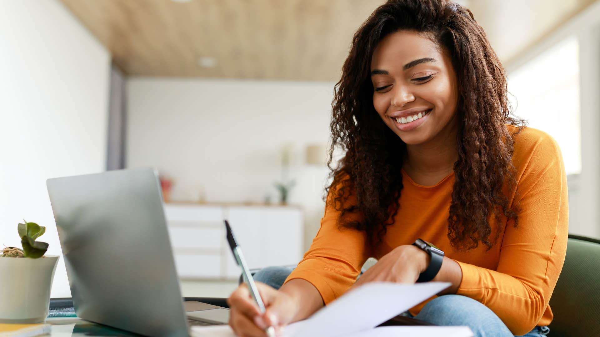 woman with good manners writing thank you notes