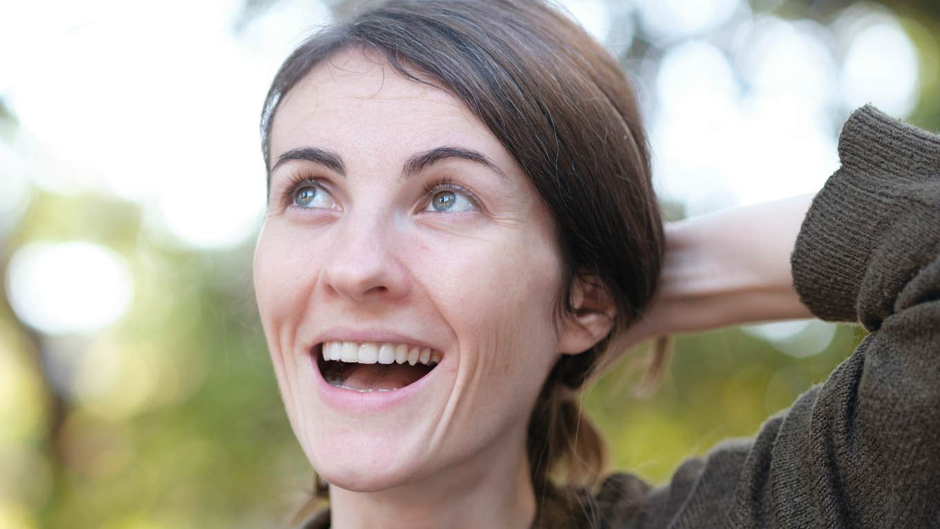 The Weird Little Activity That Can Help You Snap Out Of A Bad Mood Fast, According To Research Woman snaps out of bad mood fast.