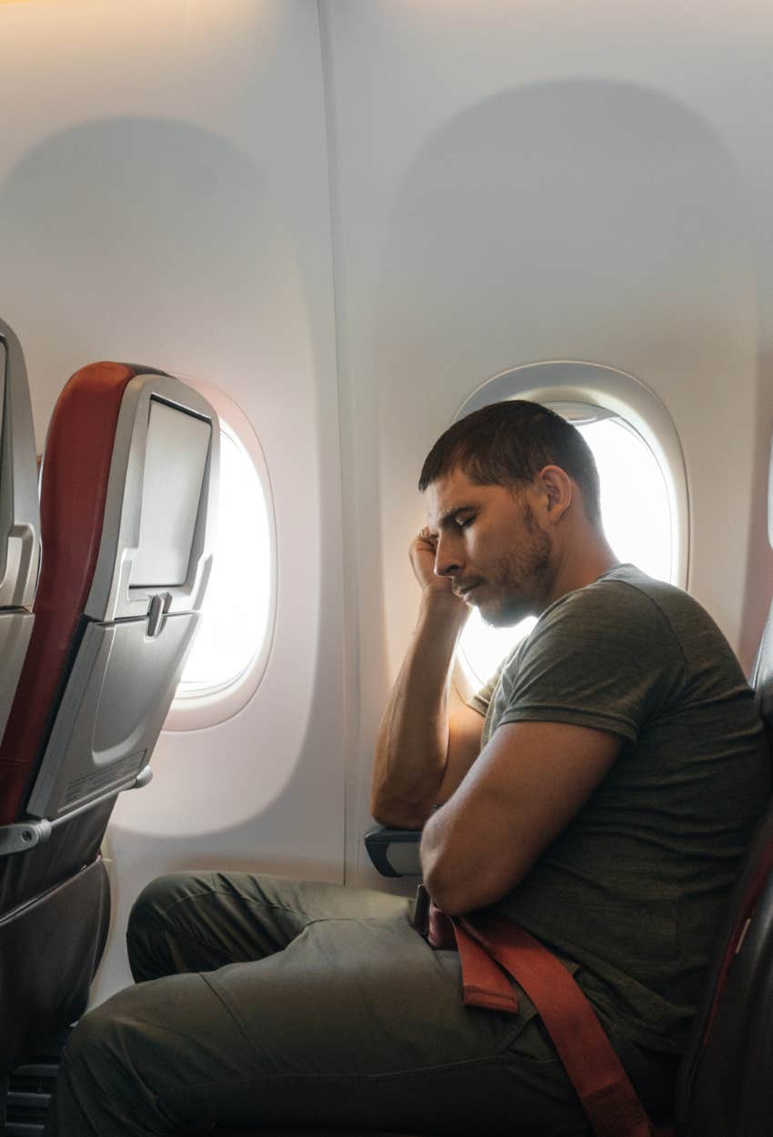 Man sitting on plane uncomfortable expert says airlines make you uncomfortable on purpose