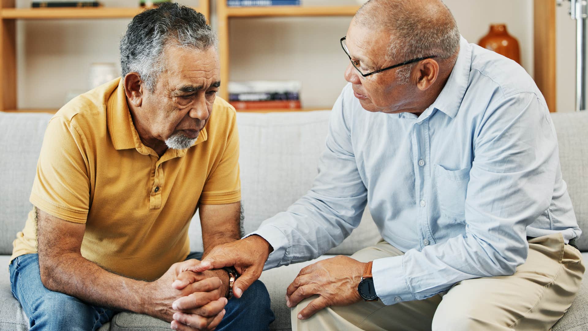 Man who's offering to help others talking to a friend.