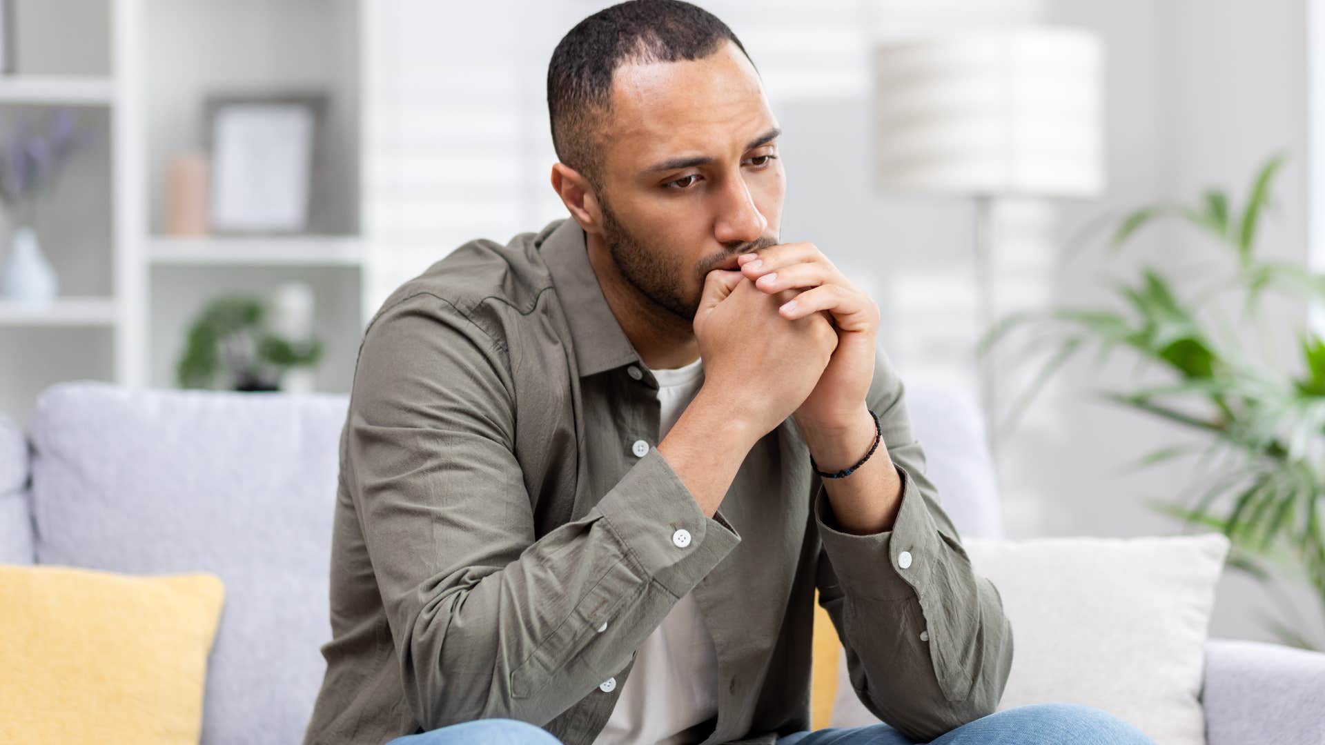 stressed man who never asks for help sitting alone