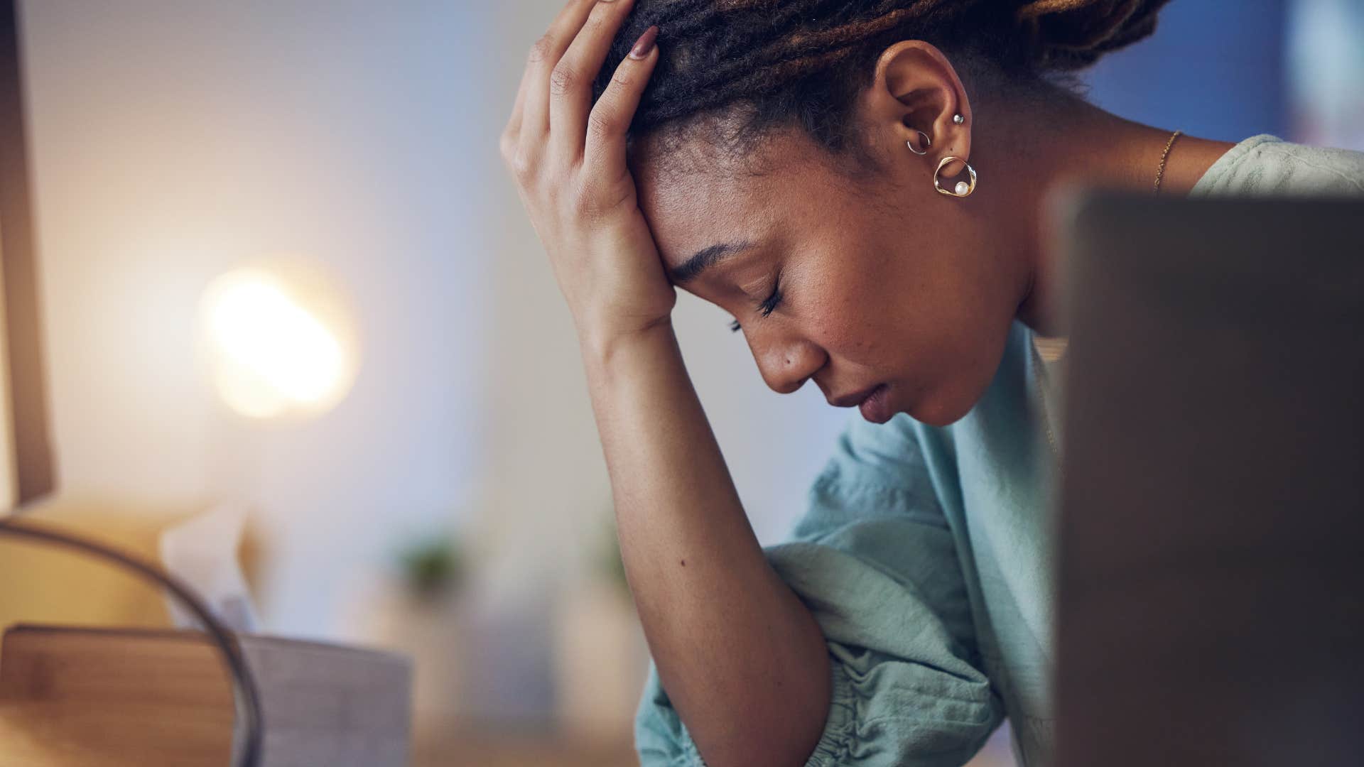 woman self-sabotaging herself looking stressed