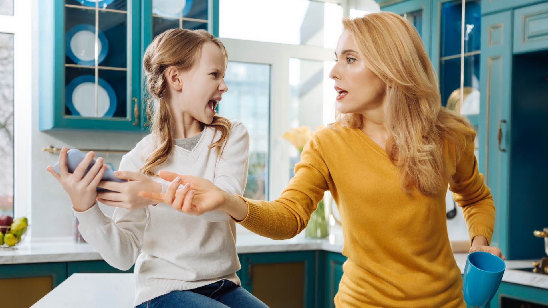 mom trying to get phone away from preteen girl