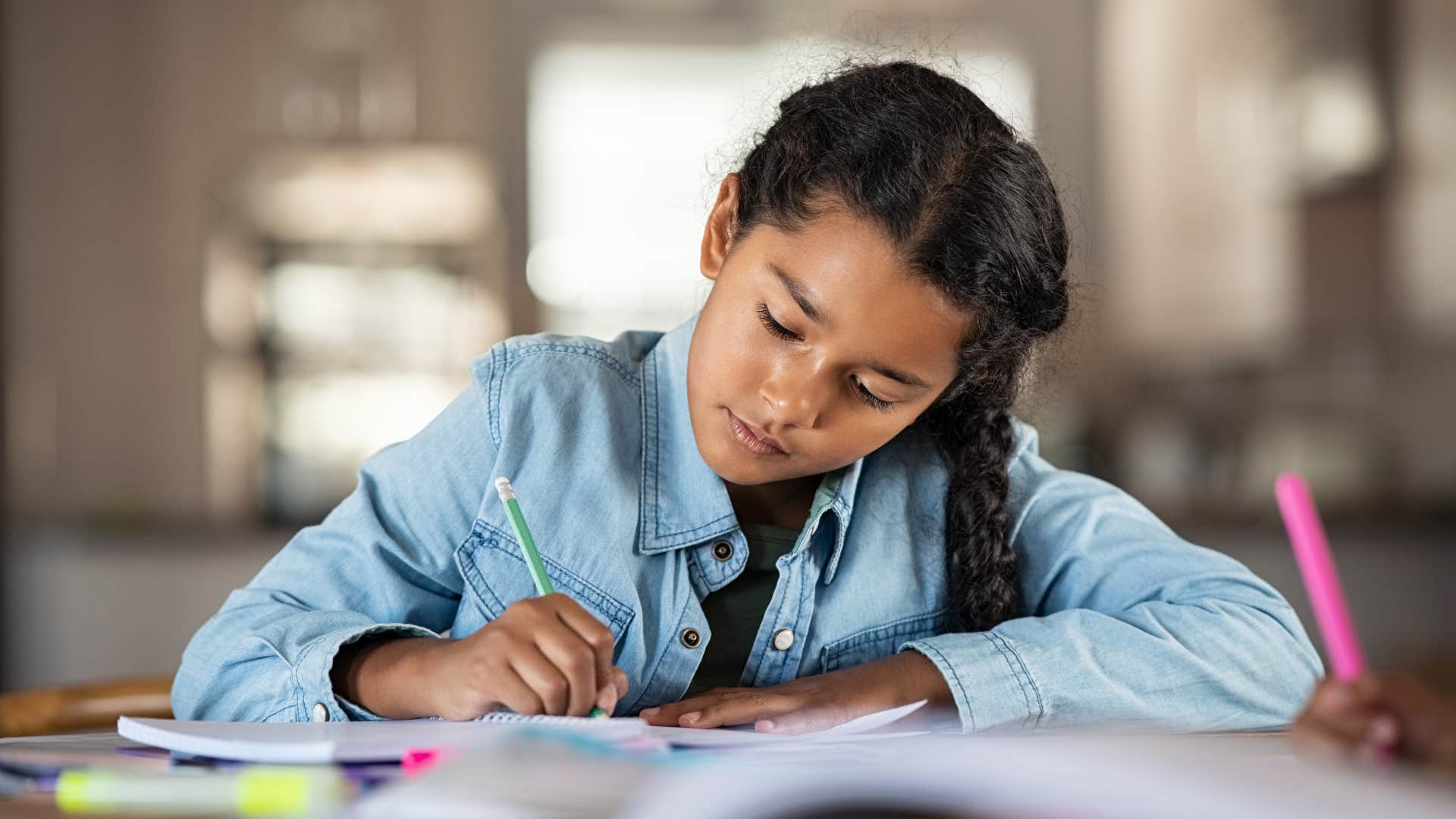 Kid taught to write by hand