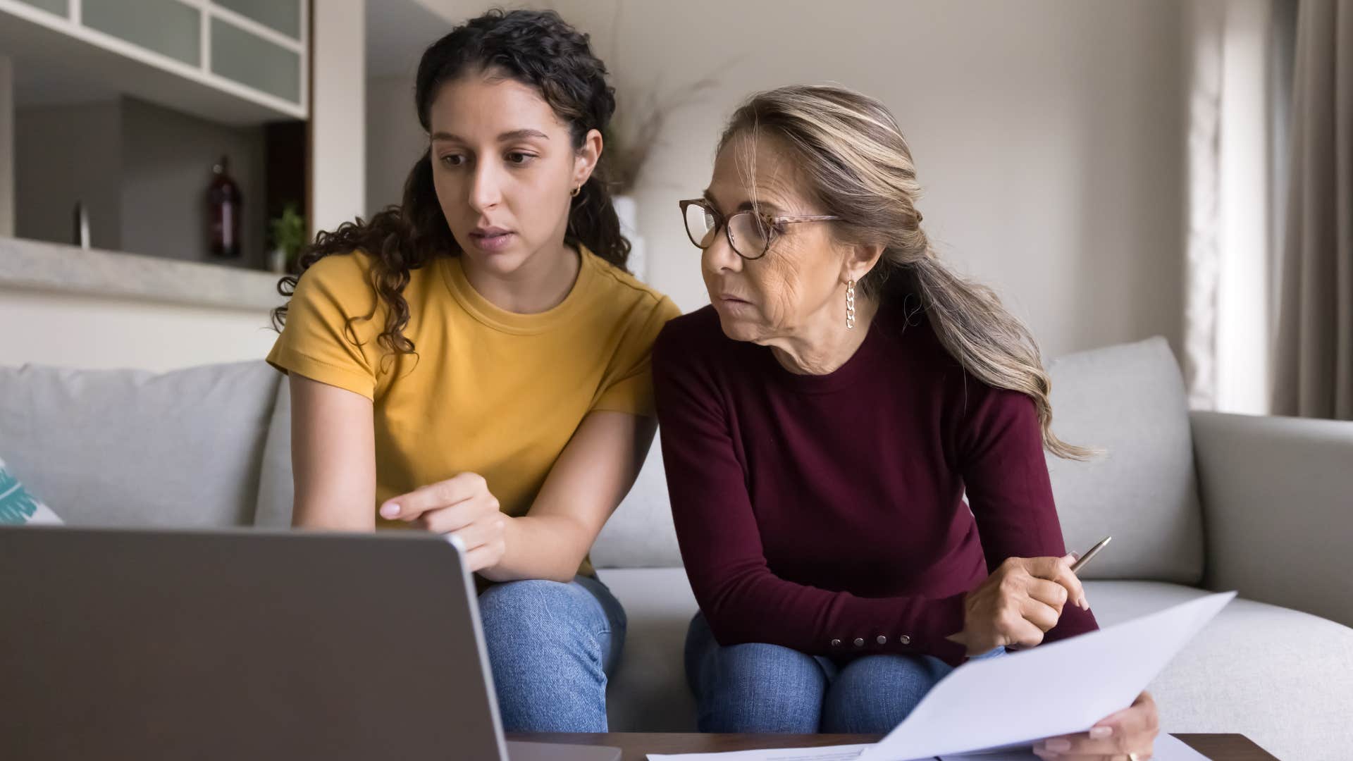 woman teaching her young daughter financial resourcefulness