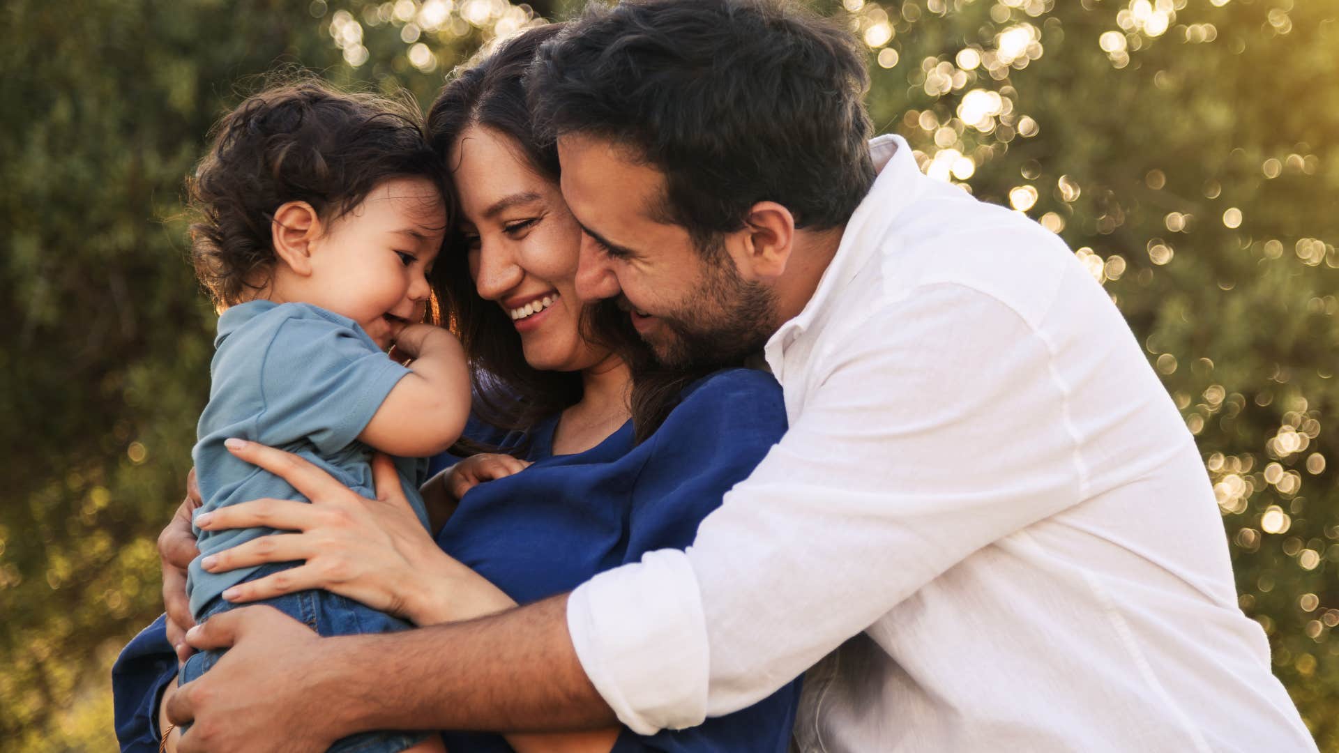 couple smiling and teaching their young son about gratitude for the little things