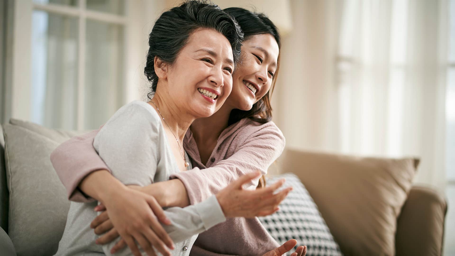woman teaching daughter kindness hugging each other