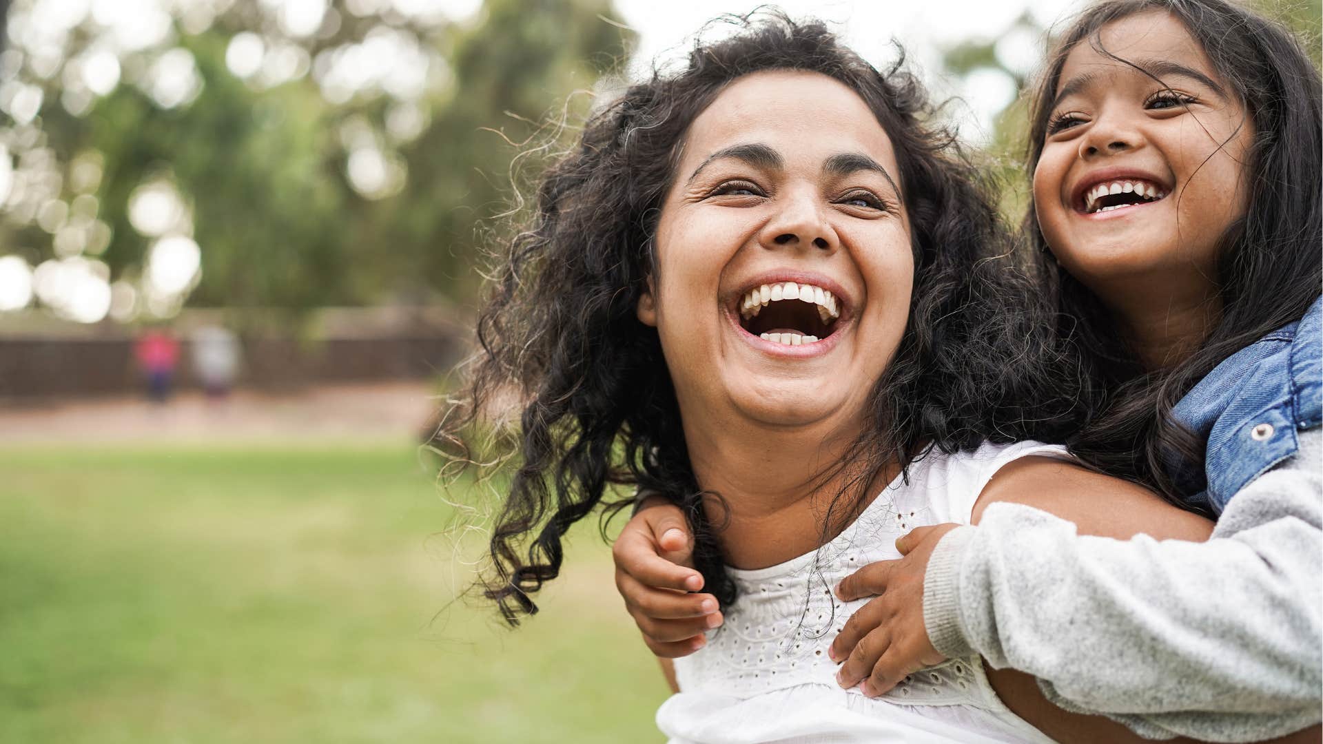woman and daughter laughing with each other
