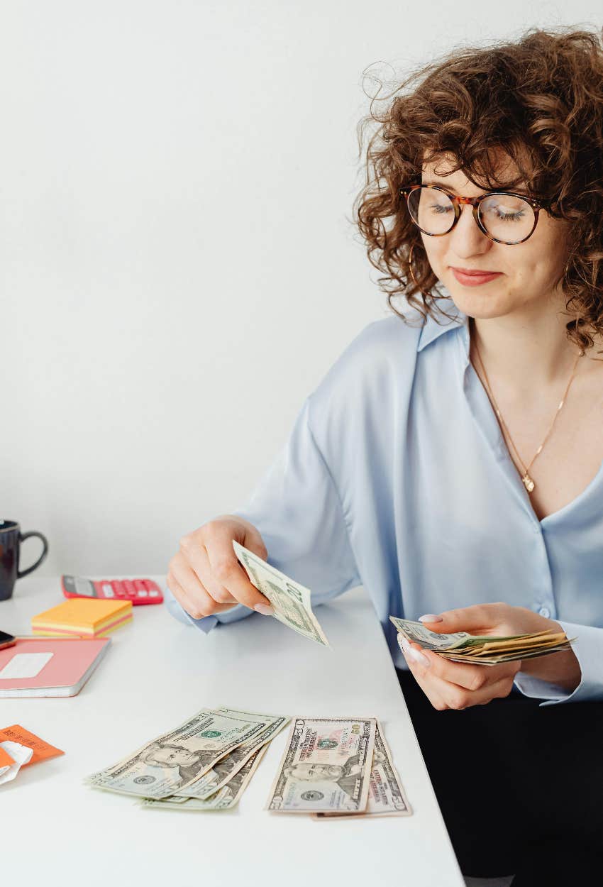 frugal woman paying herself first to keep from going broke