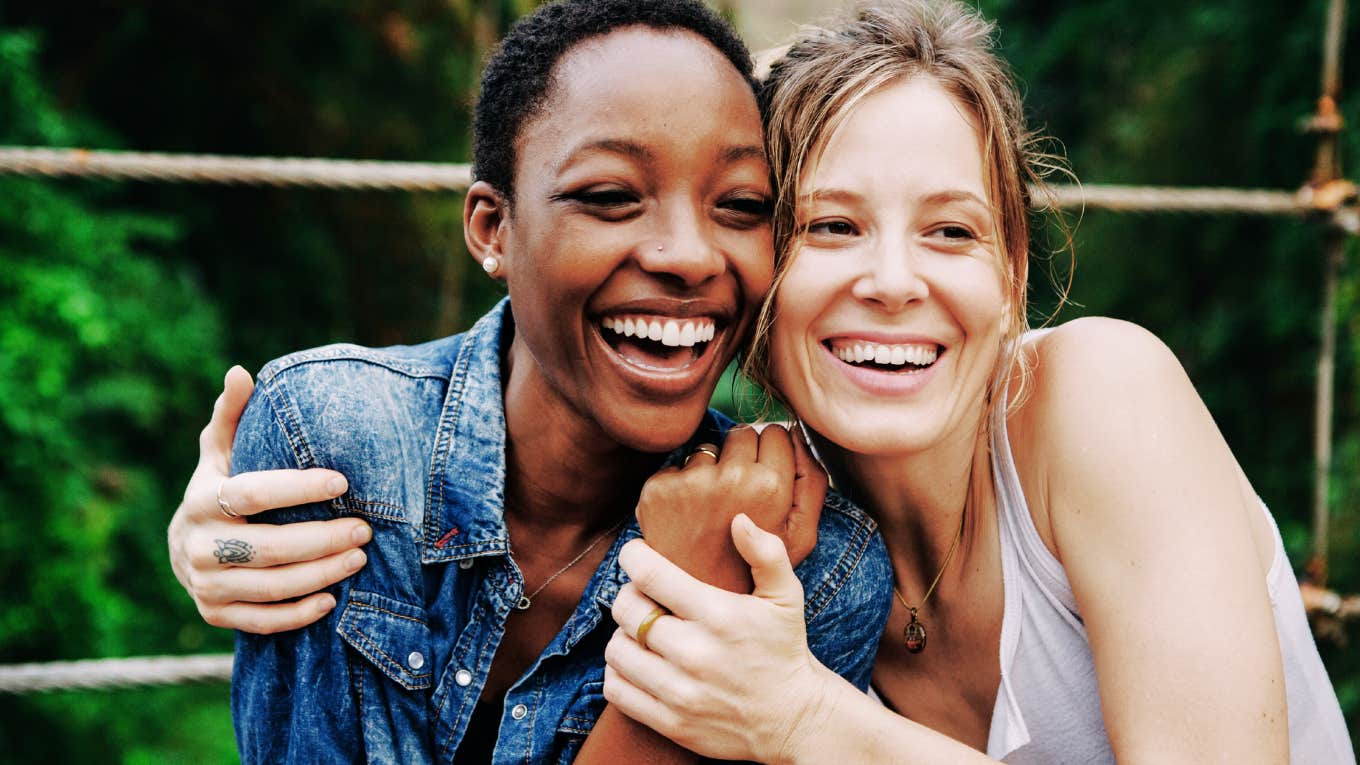 These TK Clues Reveal Which Friends Genuinely Care About You (And Which Ones Don't), According To Research Two women friends who genuinely care.