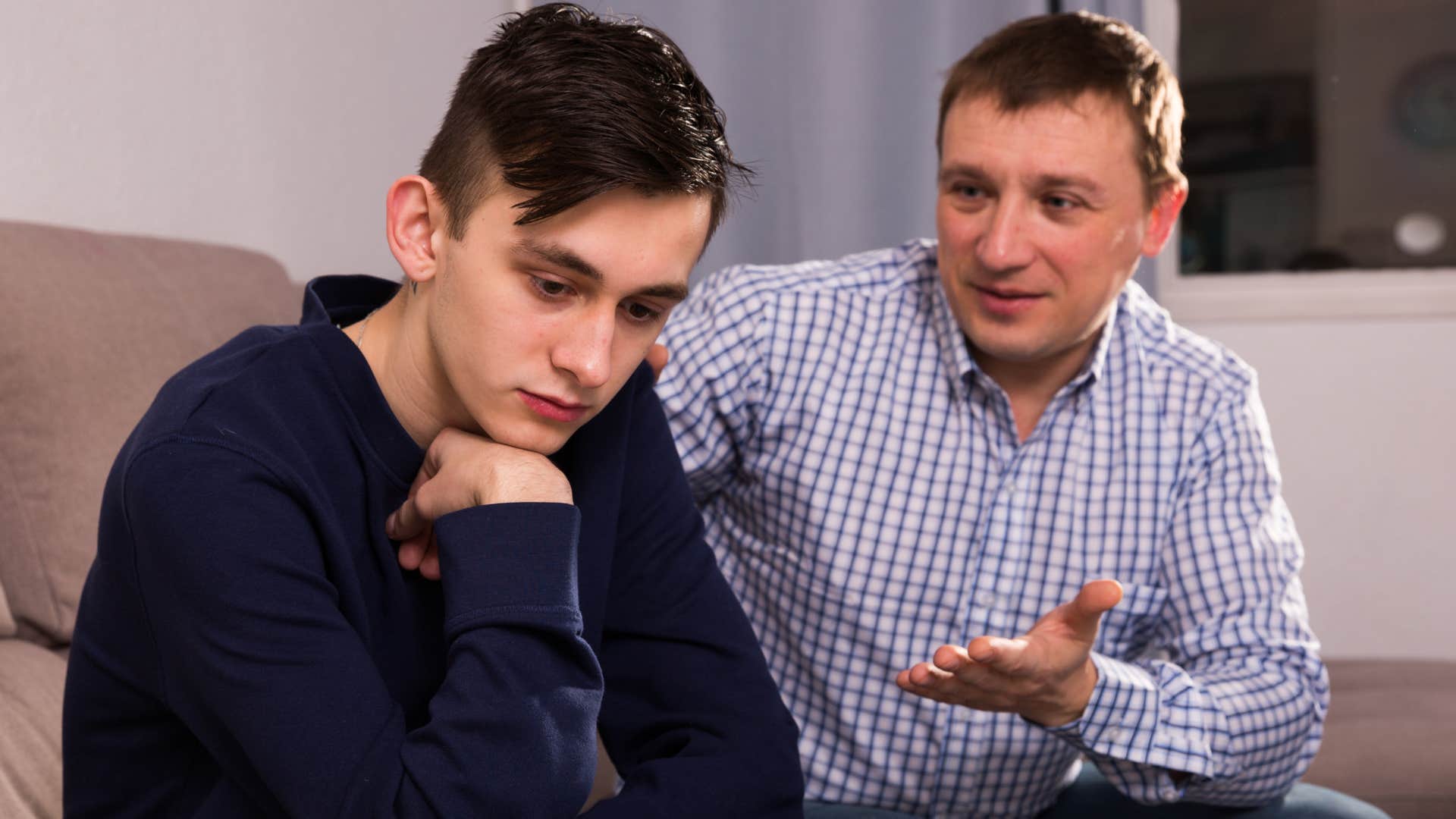 man asks his son if he minds what hes saying