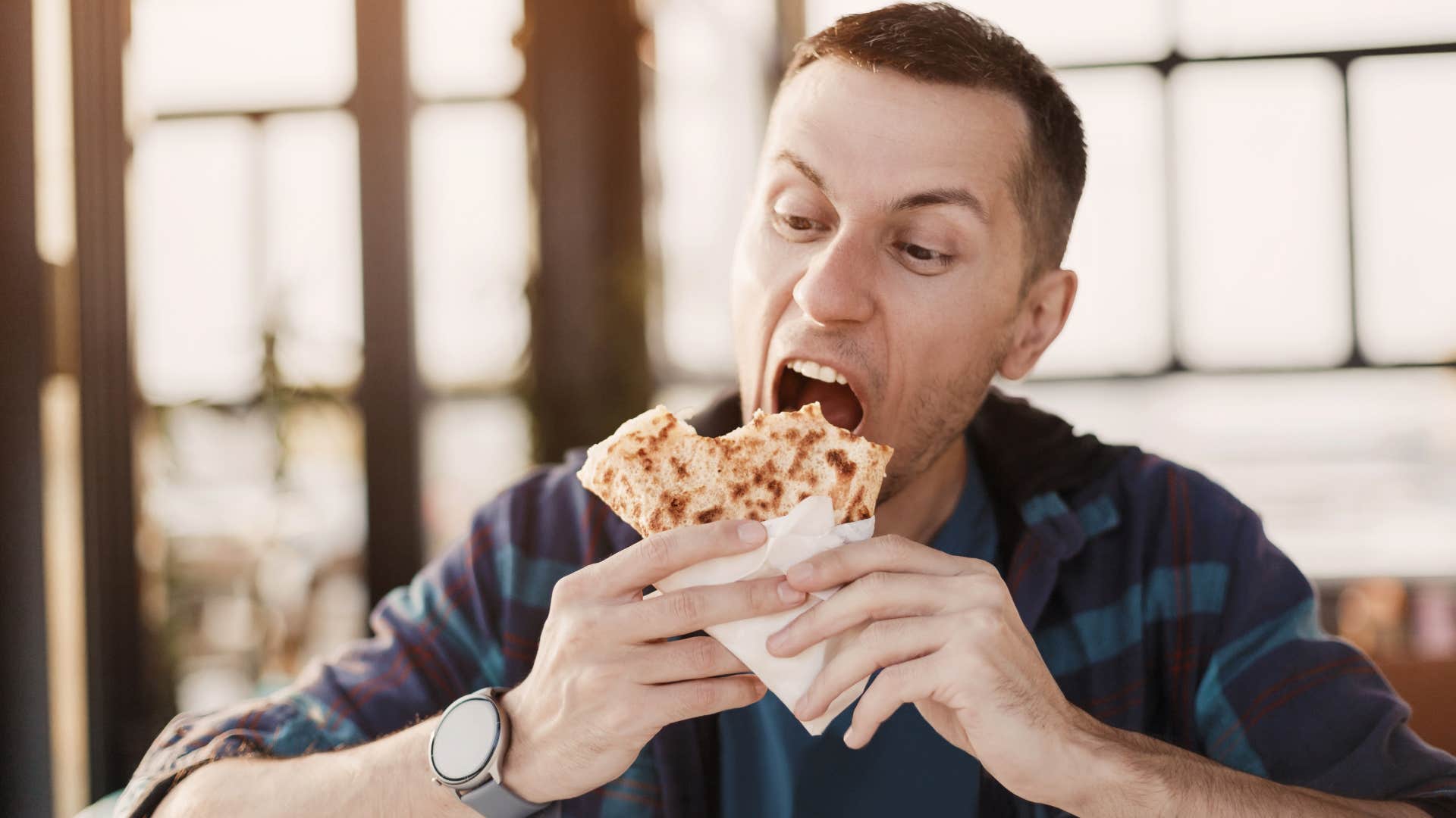 Man chewing with his mouth open