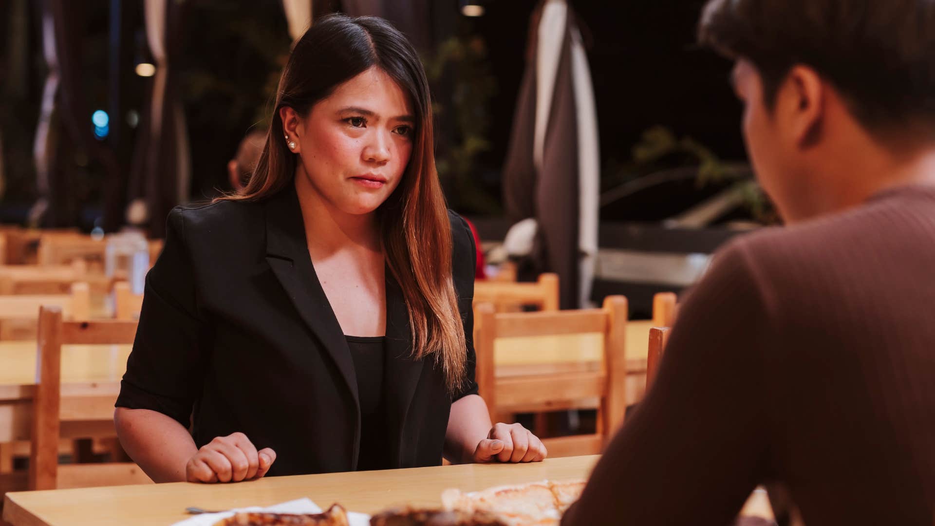 Woman criticizing the food at a restaurant