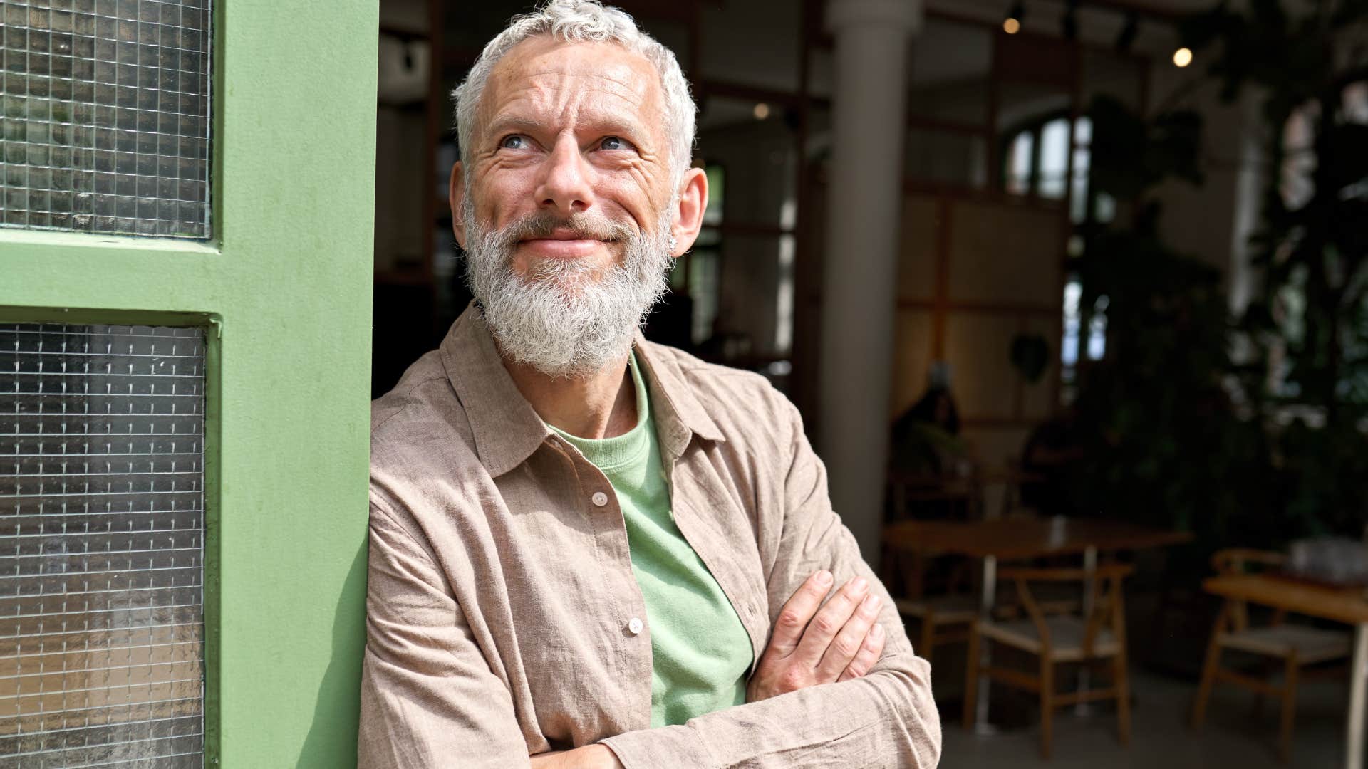  Man smiling in a restaurant after leaving abruptly