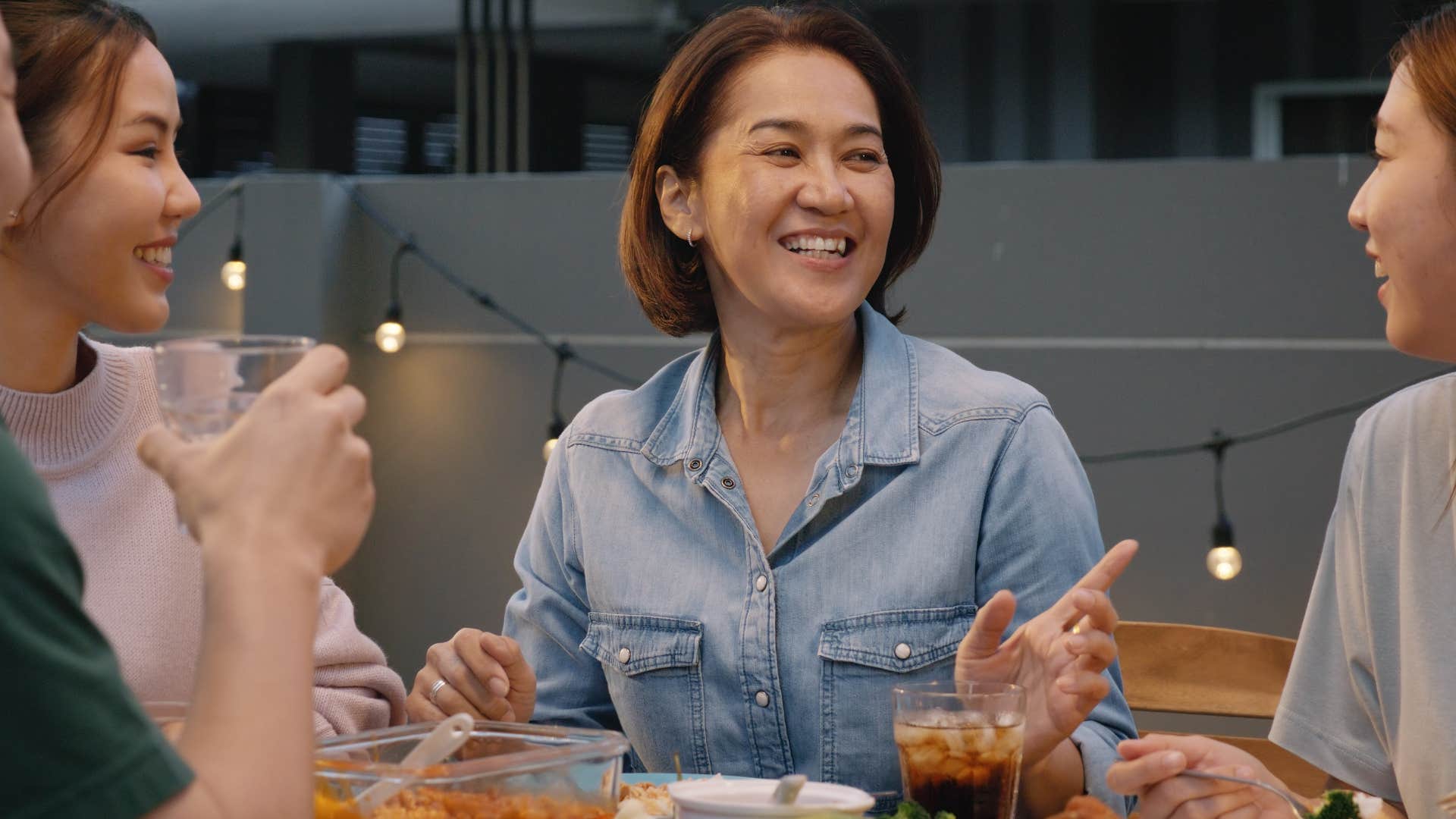 Woman saying please or thank you at dinner