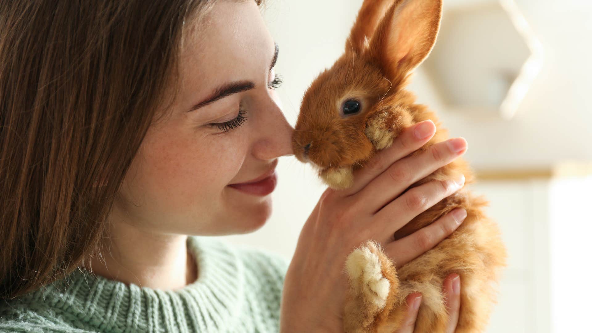 Woman holding her bunny who can't imagine life without them.