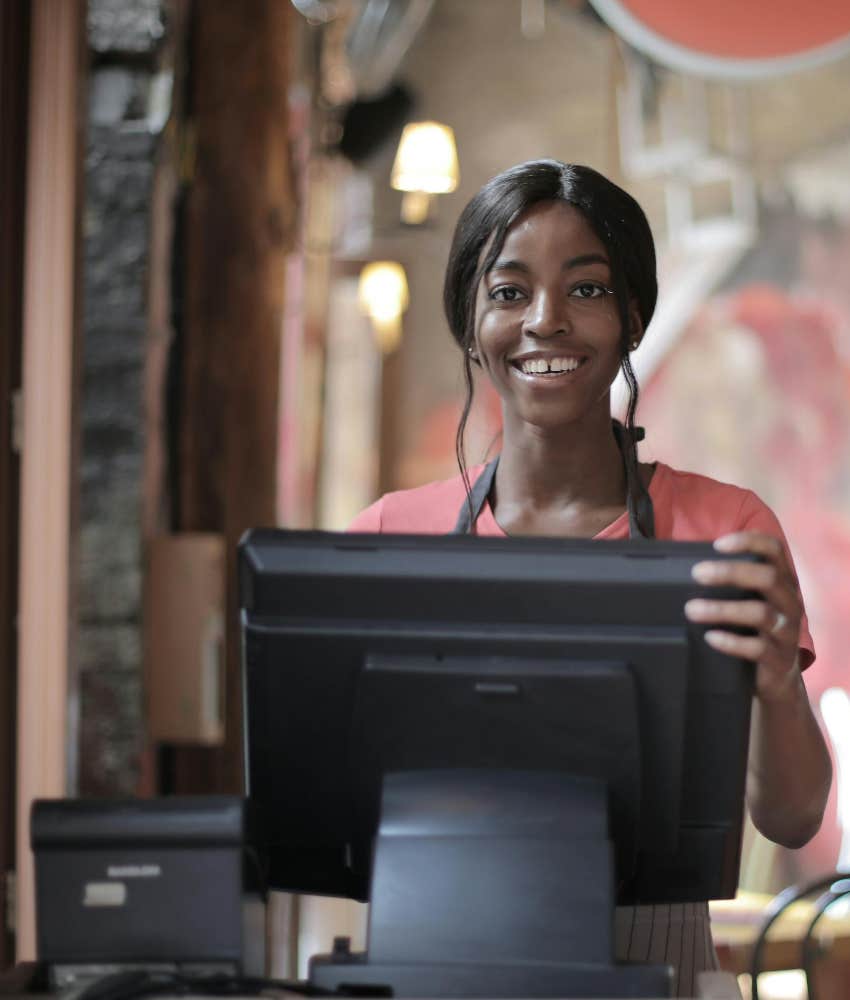 server running customer's card through at register