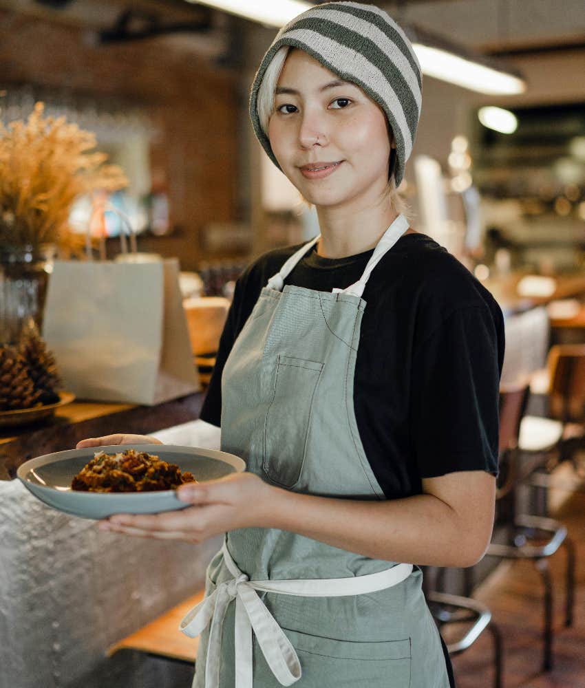 server holding customer's food