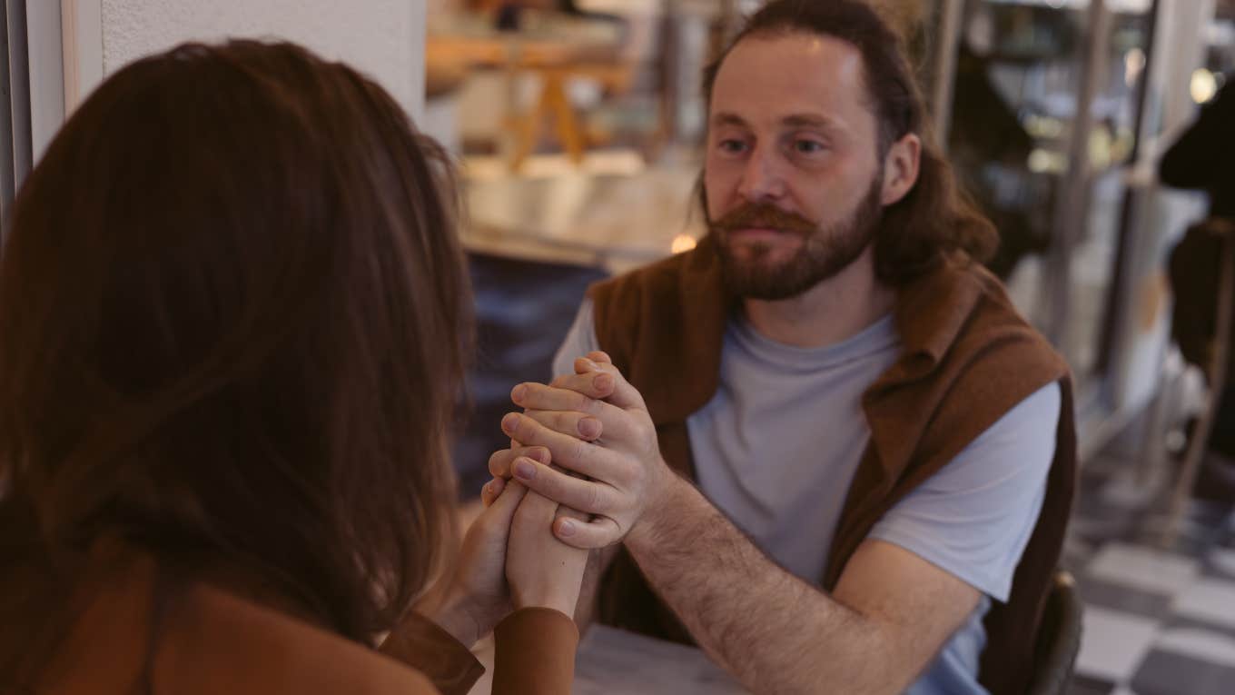Couple having deep conversations while holding hands.