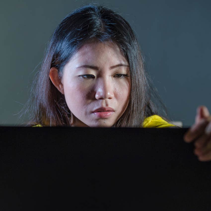 woman with new dating rules looking on computer