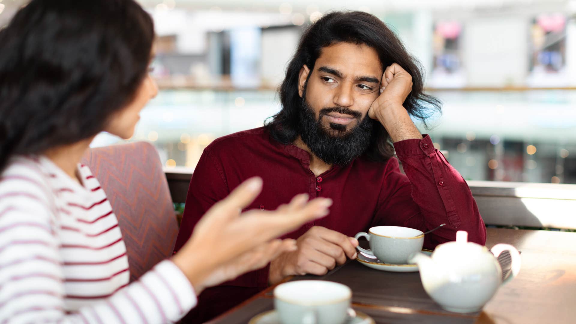Bored man pushed away by questions