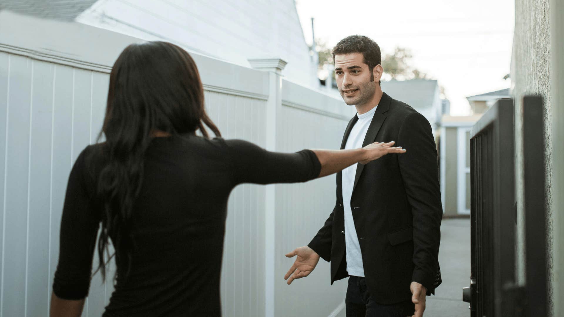 manipulative man arguing with woman by playing the bad boy