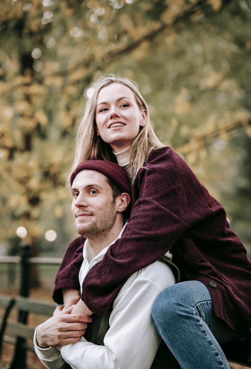 couple with emotional connection sitting on a bench