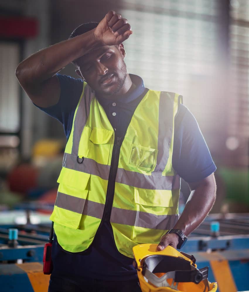 Worker looks tired.