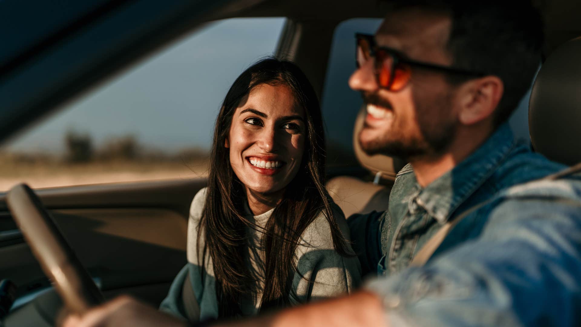 Man leaving the blinker on in the car with her partner.