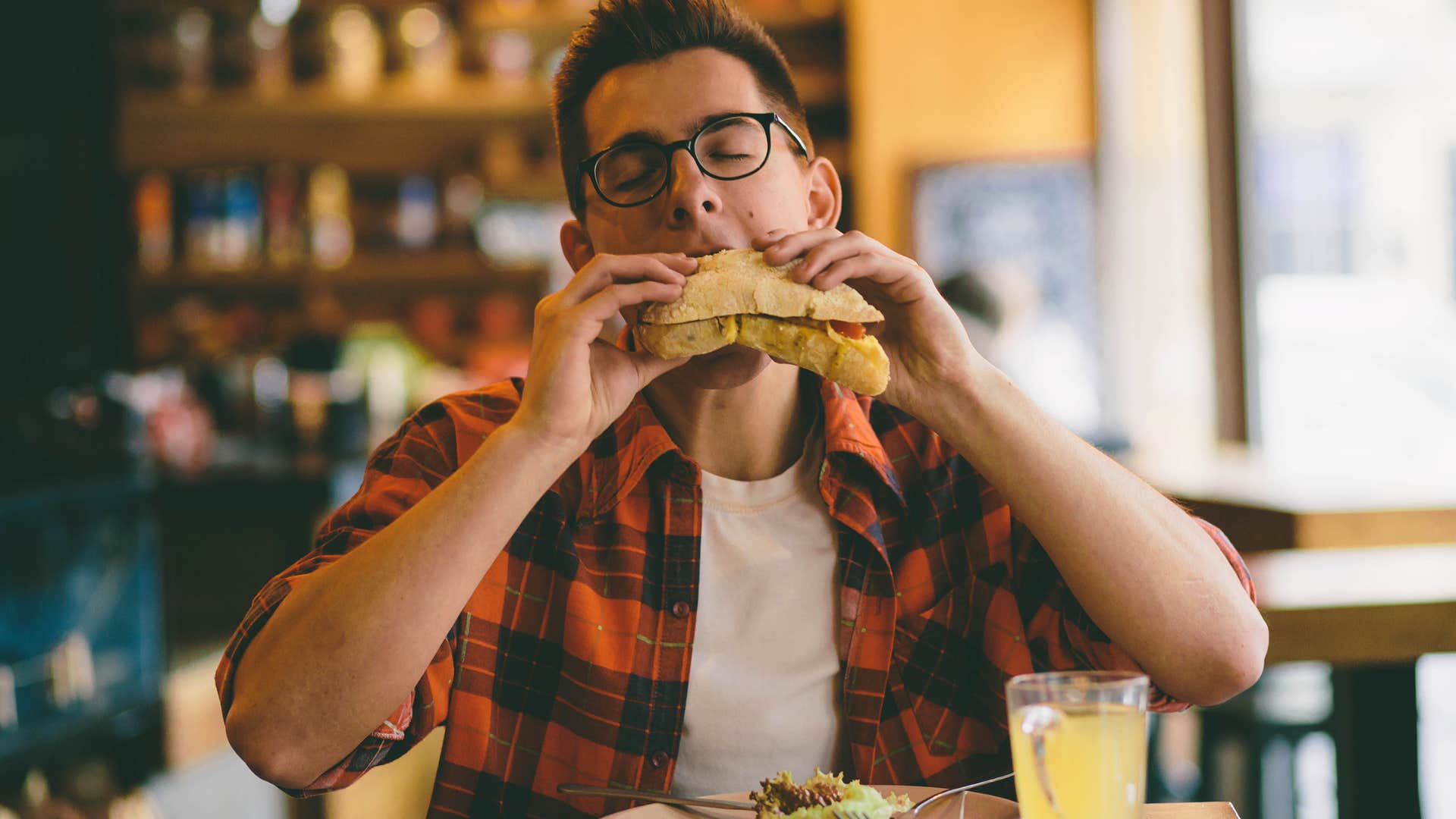 Man chewing loudly in a restaurant. 