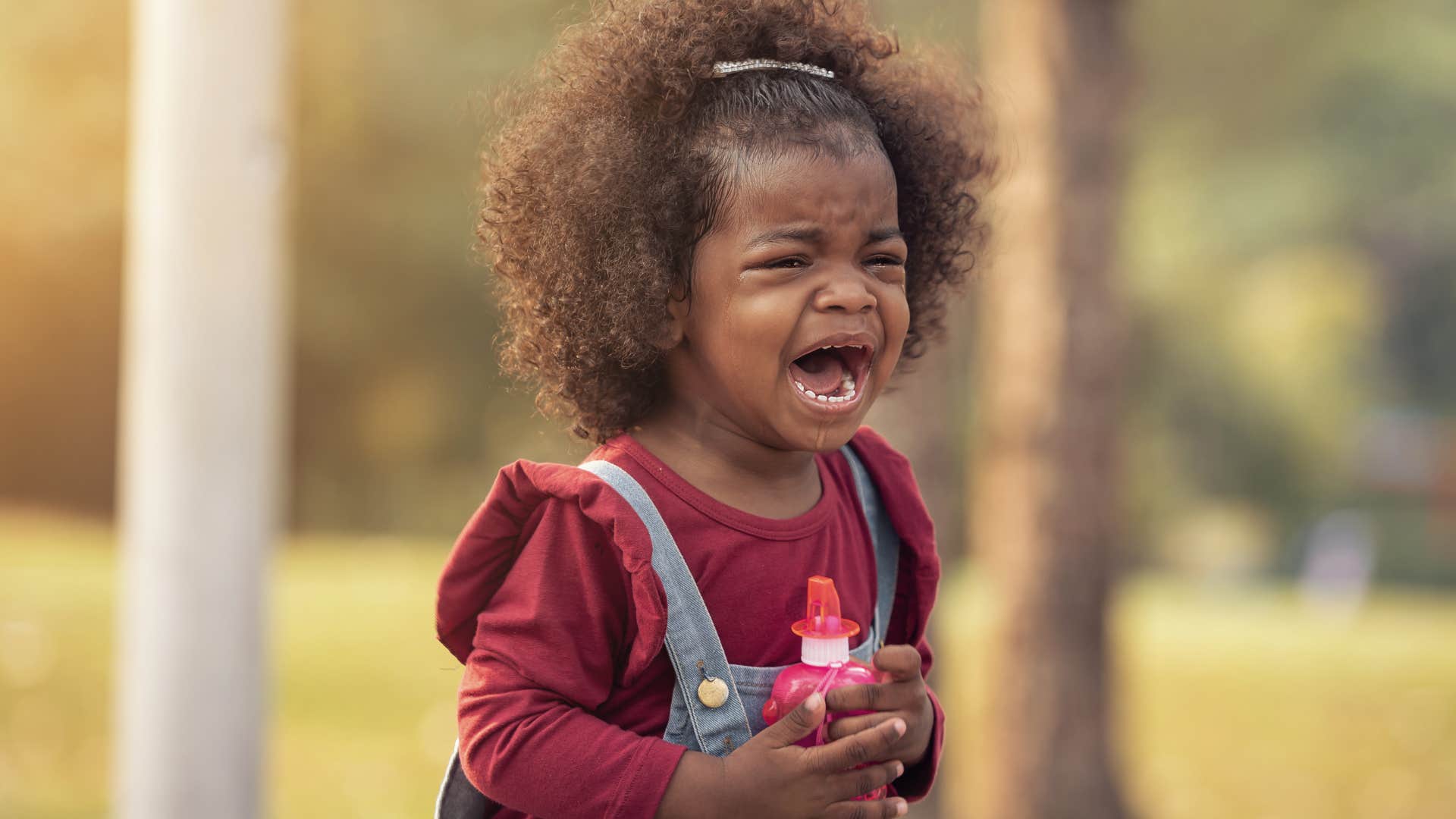 Kids crying in public in a park.