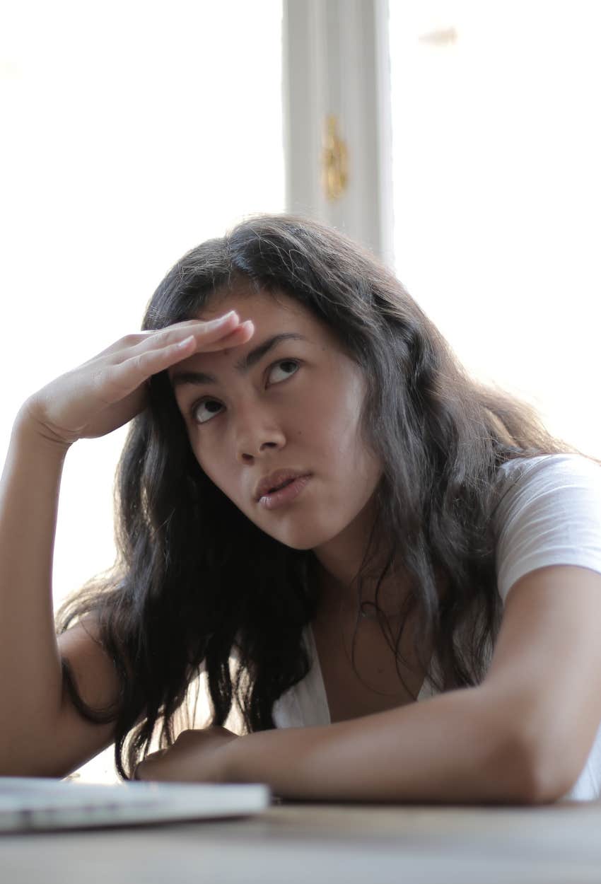 woman annoyed by someone talking to her when she wants silence