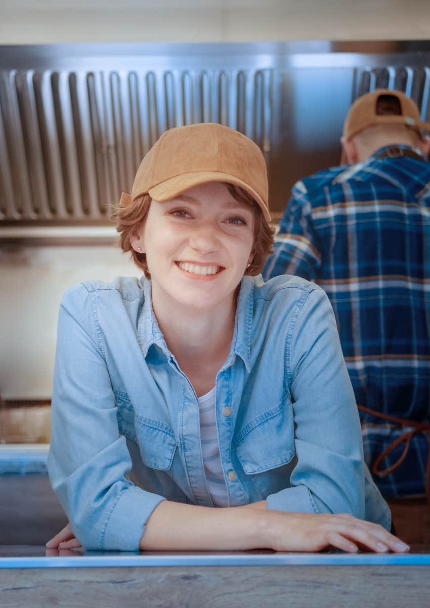 happy woman working in food truck