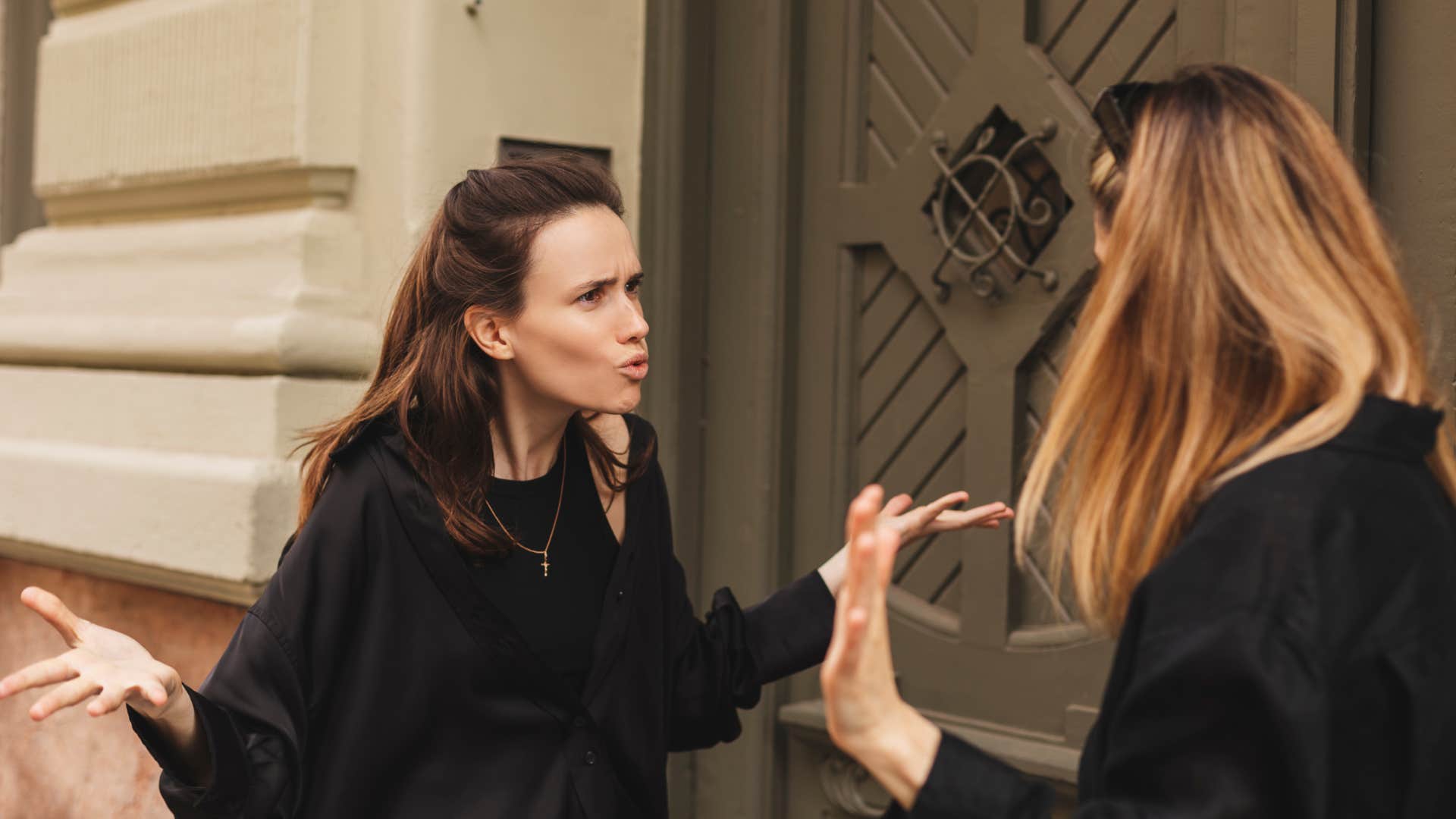 women shouting blaming friend during conflict
