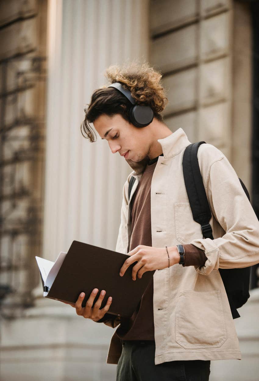 Gen Z student looking over notes for adulting classes that teach basic life skills
