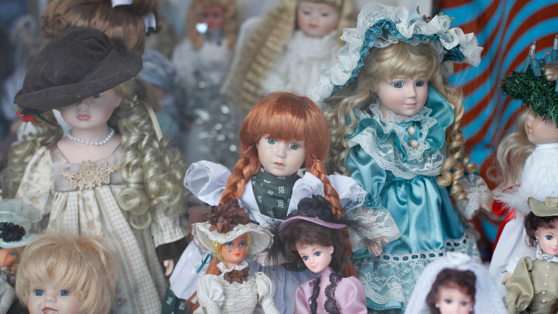 a collection of vintage dolls in different dresses
