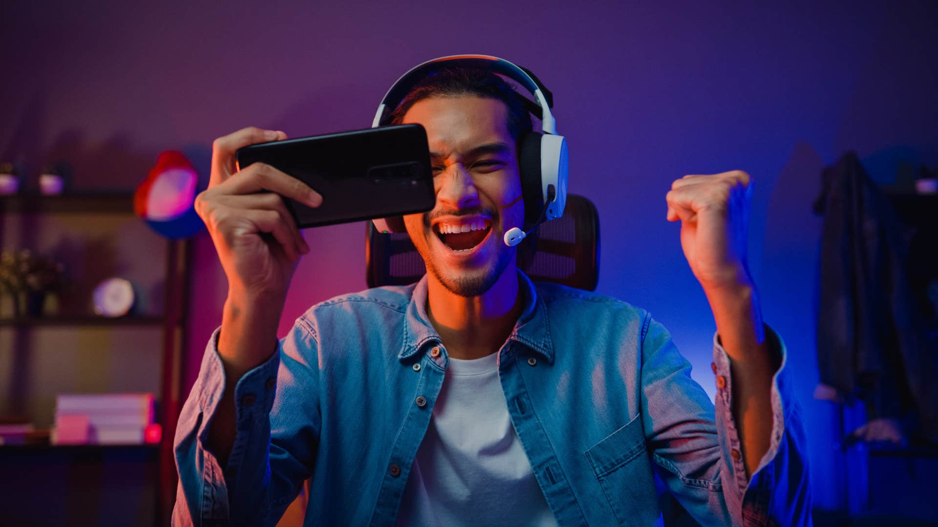 man in headphones playing video games