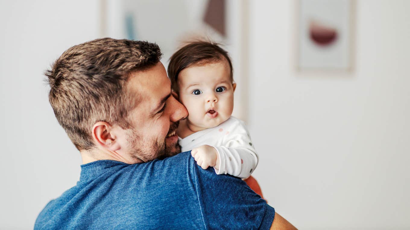 Husband Says His Wife Is Being Unfair After She Refuses To Name Their New Baby After His Mom dad holding newborn baby