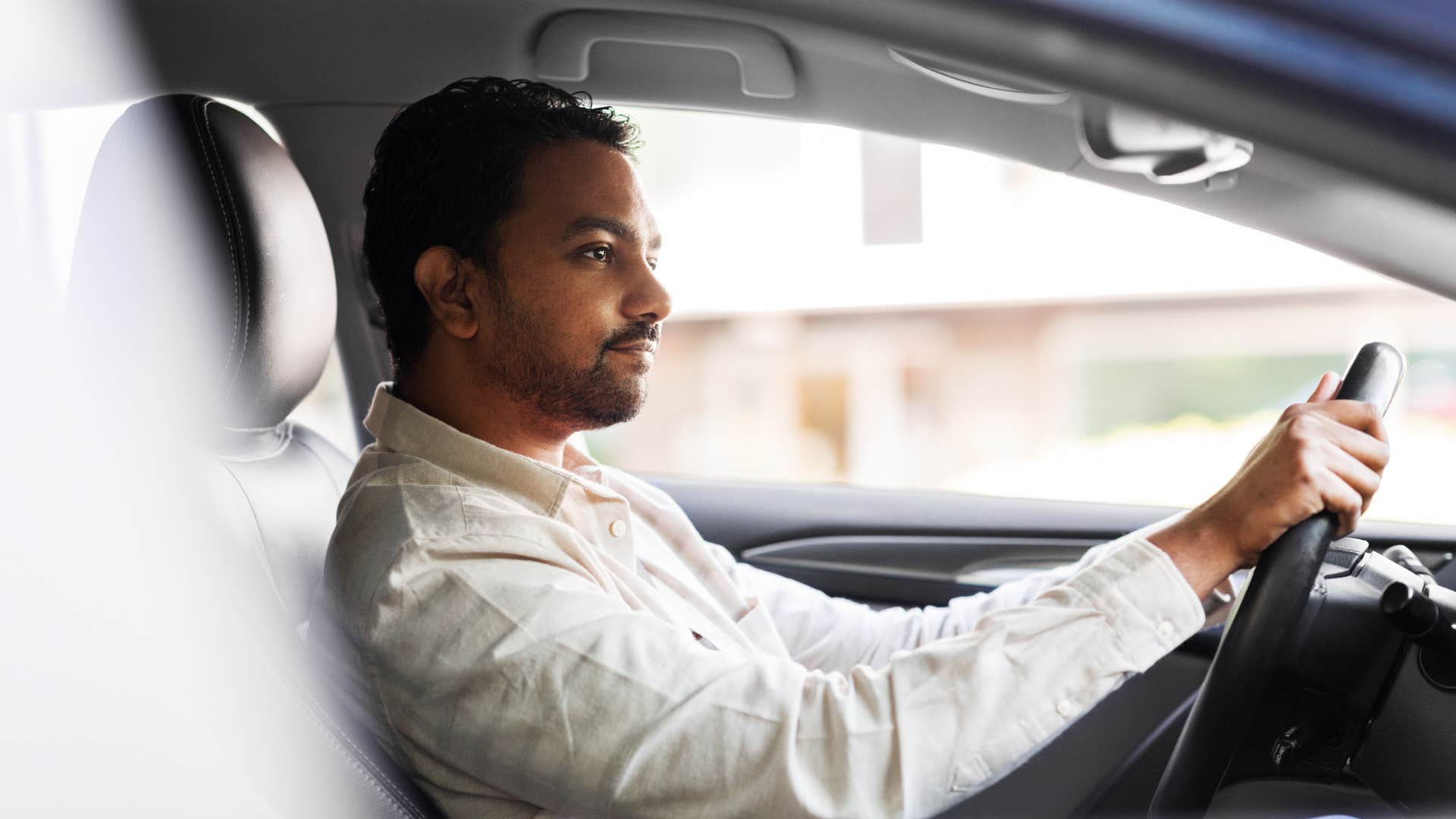 husband sitting in car and delaying coming home